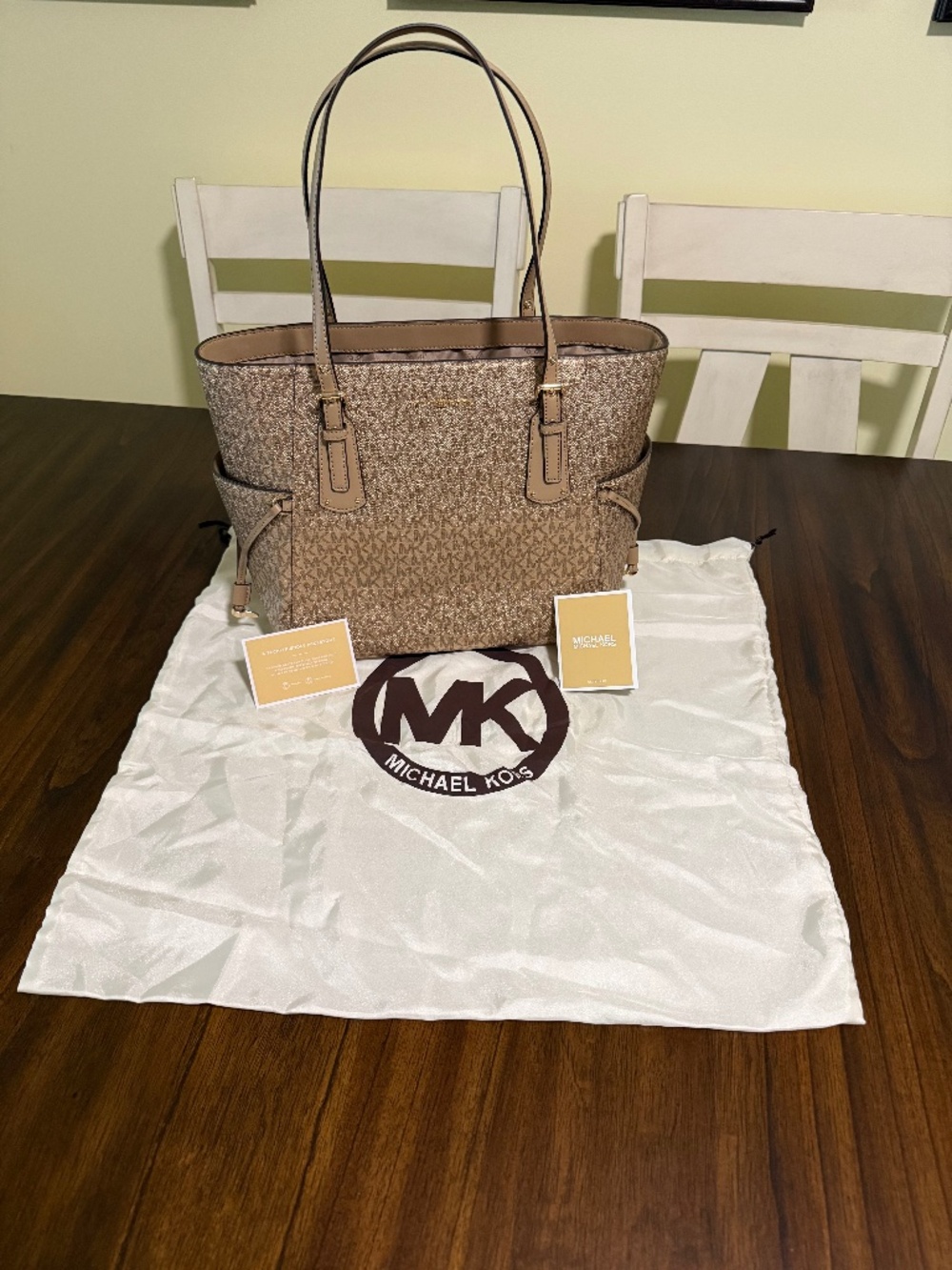 Michael Kors golden tote with original care cards and dust cover